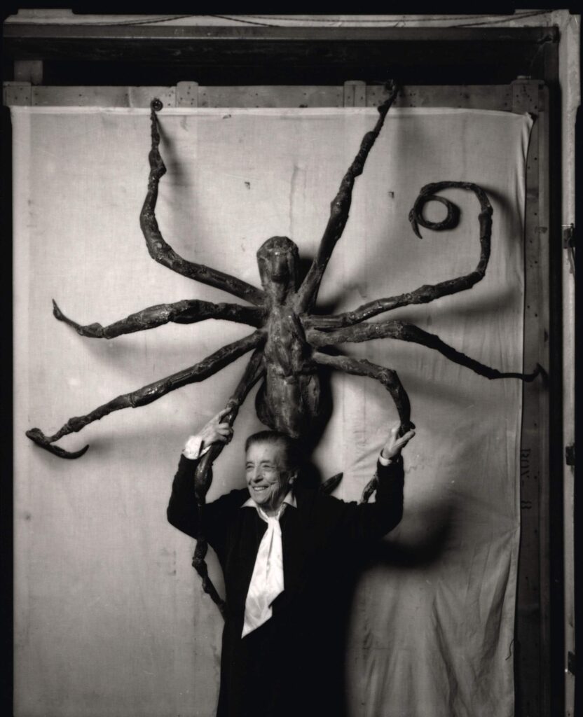 The artist pictured with the steel version of Spider IV; Sotheby’s