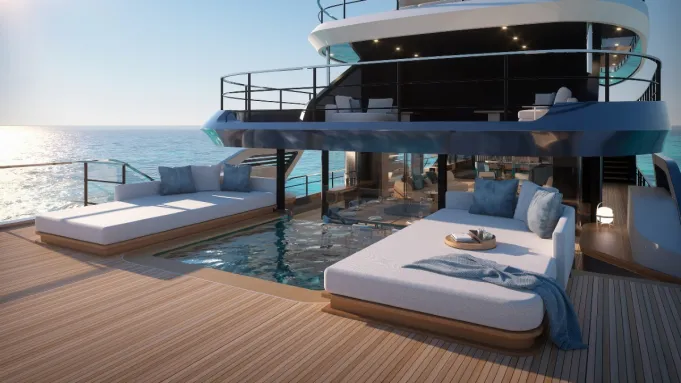 Main deck of a luxury yacht, featuring elegant furnishings, a pool, and spacious living areas.