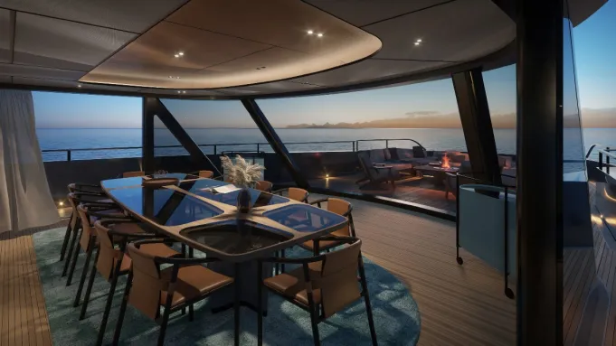 Dining room on a luxury yacht, leading to a forward terrace.