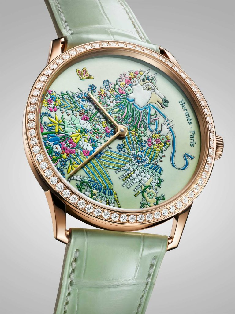 Hermès watch with a spring motif showing a horse made of florals.