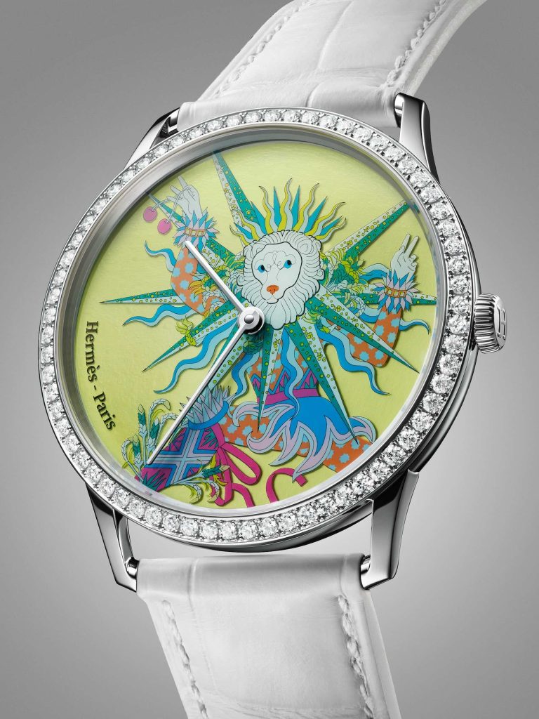 Hermès watch in a white-gold case featuring a summer motif with a lion.
